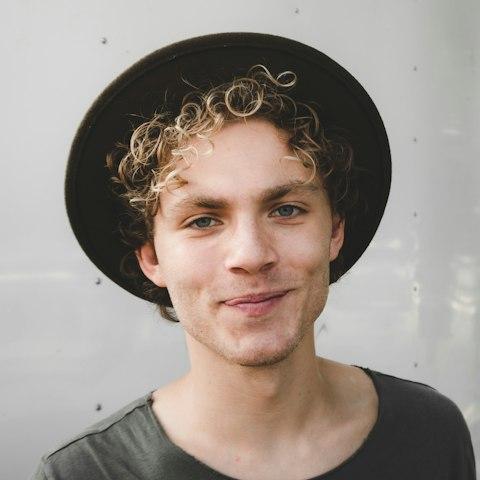 Smiling man wearing a hat